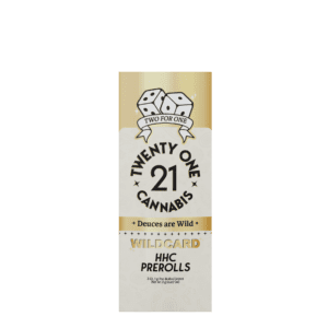 A rectangular beige package labeled "Twenty One Cannabis" featuring a dice graphic and the text "Deuces are Wild." Inside, you'll find the "Wildcard HHC Prerolls," which are described as containing 2 Premium Pre-Rolled Joints with Herbal Terpenes.