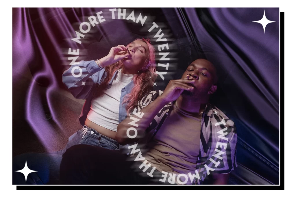 A couple lies on black cloth, smoking prerolls and feeling high