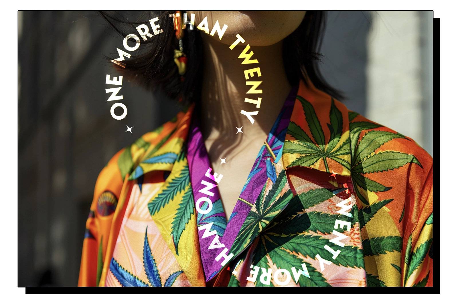 A woman dressed in a vibrant, colorful shirt adorned with cannabis leaf prints