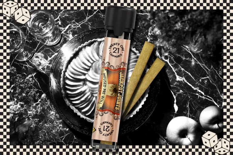 A Jackpot Joints infused pre-roll placed against a dark background